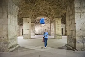 Underground Prints: Tourist exploring the underground halls at Diocletians Palace