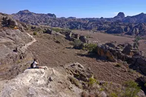 Taking A Picture Prints: Tourist looking over the rock formations of the Isalo National Park, Madagascar, Africa