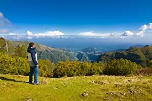 Images Dated 15th February 2010: Tourist looking at the stunning scenery of Pico de Ariero, Madeira, Portugal, Europe