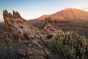 Photogenic Prints: A tourist observes Teide volcano from La Ruleta viewpoint during sunrise