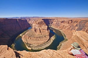 Tourist overlooking Horseshoe Bend on the Colorado River, Page, Arizona, United States of America, North America