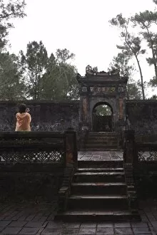 Tourist photographing Dai Hong Mon, Minh Mang Tomb, Hue, Vietnam, Indochina