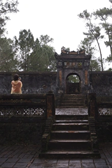Images Dated 12th April 2007: Tourist photographing Dai Hong Mon, Minh Mang Tomb, Hue, Vietnam, Indochina