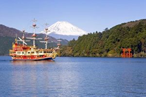 Volcanoe Prints: Tourist pleasure boat on lake Ashino-ko with the red