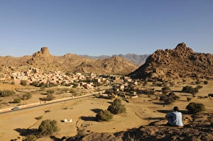 Images Dated 21st May 2008: Tourist relaxing in the magical landscape of Tafraoute, Southern Morocco