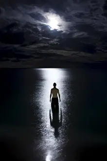 Surat Thani Prints: Tourist standing in the ocean watching the moon rise on Haad Rin Nai beach