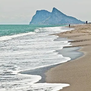 Sandy Beach Prints: Tourist walking toward Gibraltar