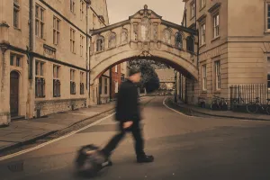 College Prints: A tourist walking past the Bridge of Sighs in Oxford