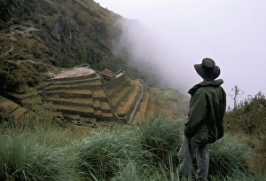 Incan Prints: Tourist watches clouds swirl around mountains