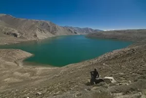 Tourist at the Yashil Kul lake, The Pamirs, Tajikistan, Central Asia