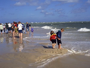 Paddling Prints: Tourists on the beach at the meeting of the Kattegat and Skagerrak Seas