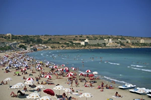 Malta Prints: Tourists on the beach at Mellieha Bay on the island of Malta