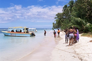 Tobago Prints: Tourists boarding a glass bottom boat at Pigeon Point