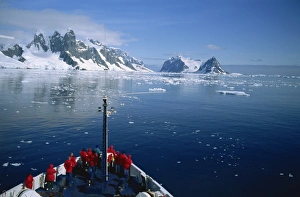 Antarctica Prints: Tourists on the bow of a cruise ship off the Antarctic Peninsula, Antarctica
