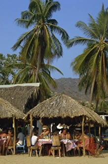 Acapulco Prints: Tourists at a cafe on the beach at Acapulco