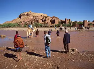 Ait Ben Haddou Prints: Tourists cross river Asif Mellah to visit Kasbah Ait Ben Haddou