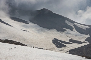 Kamchatka Prints: Tourists crossing a snowfield, Mutnovsky volcano, Kamchatka, Russia, Eurasia