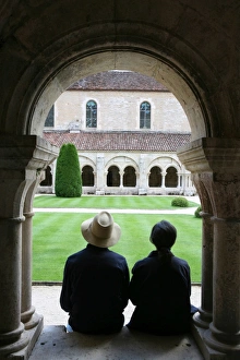 Tourists in Fontenay Cistercian Abbey cloister, UNESCO World Heritage Site