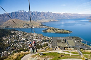 Couples Prints: Two tourists on the gondola to the luge track above Queenstown
