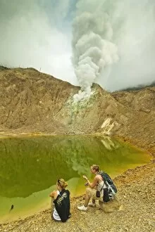 Images Dated 15th June 2010: Tourists by green crater lake and fumaroles at Papandayan Volcano, an active four crater caldera