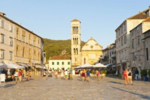 Tourists on holiday in St. Stephens Square, Hvar Town, Hvar Island, Dalmatian Coast, Croatia, Europe