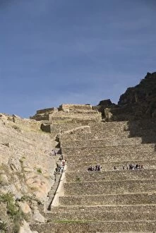 Tourists on huge stone terraces in the Inca ruins of Ollantaytambo, The Sacred Valley