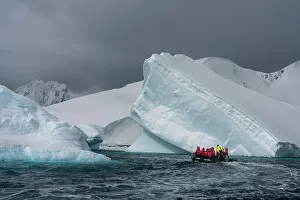 Polar Climate Prints: Tourists in an inflatable boat exploring Pleneau Island, Antarctica, Polar Regions