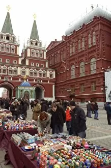 Images Dated 9th February 2008: Tourists look at souvenirs near The Resurrection Gate, Moscow, Russia, Europe
