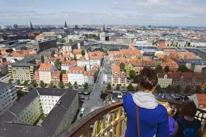 View Points Prints: Tourists looking at view from the 17th century Vor Frelsers Church, Copenhagen