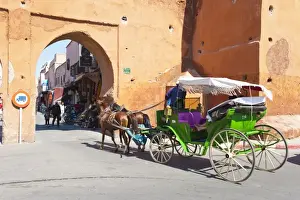 Carriage Prints: Tourists in Marrakech enjoying a horse and cart ride around the old medina