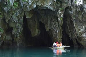 Sabang Prints: Tourists in paddle boat at entrance to Riverine Cave