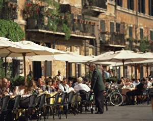 Tourists at a pavement cafe on the Piazza Navona in the city of Rome, Lazio Tourists at a pavement cafe on the Piazza Navona in the city of Rome, Lazio