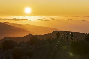 3 People Prints: Tourists photographing sunset with smartphone from Pico Ruivo mountain peak, Madeira