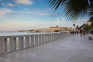 Balustrade Prints: Tourists on the promenade with the medieval old town in the background