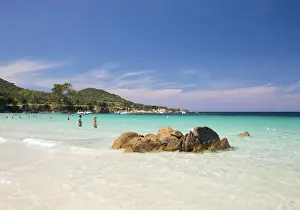 Corsica Prints: Tourists relaxing in shallow turquoise water off the Plage de Verghia
