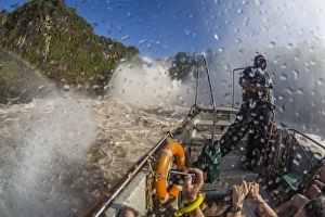Tourists take a river boat to the base of the falls, Iguazu Falls National Park