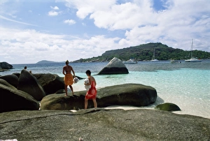 Praslin Prints: Tourists on rocks