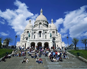 Tourists sitting on steps before the Sacre Coeur, Montmartre, Paris, France, Europe