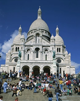 Basilica Prints: Tourists sitting on steps before the Sacre Coeur, Montmartre, Paris, France, Europe