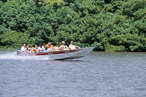 Lencois Maranhenses Prints: Tourists in speed boat riding on Rio Preguica, Parque Nacional dos Lencois Maranhenses
