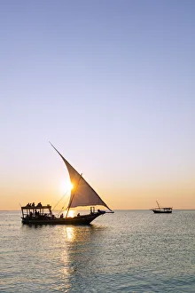 Tourist Boat Prints: Tourists on a sunset cruise on the Indian Ocean, Nungwi, Island of Zanzibar, Tanzania
