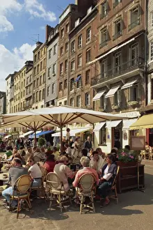 Honfleur Prints: Tourists at tables in the waterfront pavement cafes and open air restaurants in the town of Honfleur