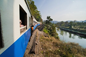 Carriages Prints: Tourists on a train ride on the Death Railway along the River Kwai