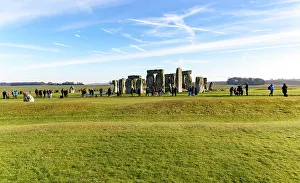History Buffs Prints: Tourists view standing stones of Neolithic henge
