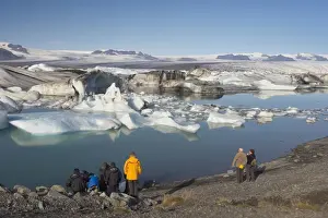 Ice Berg Prints: Tourists viewing icebergs in Jokulsarlon glacial lagoon
