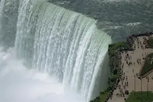 Look Out Prints: Tourists on viewing platform on Canadian side of the waterfall view the Horseshoe Falls at Niagara
