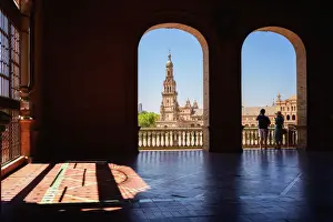 Public Park Prints: Tourists viewing the Plaza de Espana in Parque de Maria Luisa at night, Seville, Andalucia