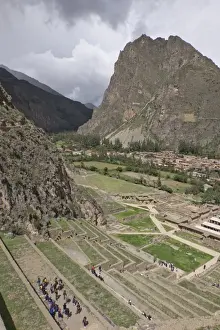 Inca Prints: Tourists visit the ruins of the Inca archaeological site of Ollantaytambo near Cusco