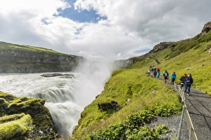 Gullfoss Prints: Tourists visiting Gullfoss (Golden Falls), a waterfall located in the canyon of