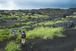 Lava Prints: Tourists walking through the lava landscape of the Tolbachik volcano